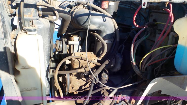 image for item K4508 1987 Ford FT900 rollback truck