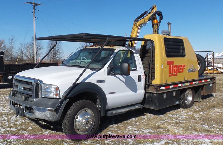 image for item AX9224 2006 Ford F550 flatbed truck with Tiger Rail Kat boom mower