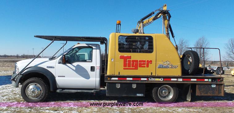 image for item AX9224 2006 Ford F550 flatbed truck with Tiger Rail Kat boom mower