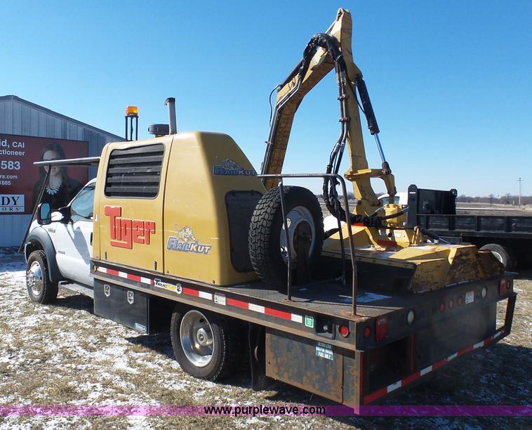 image for item AX9224 2006 Ford F550 flatbed truck with Tiger Rail Kat boom mower
