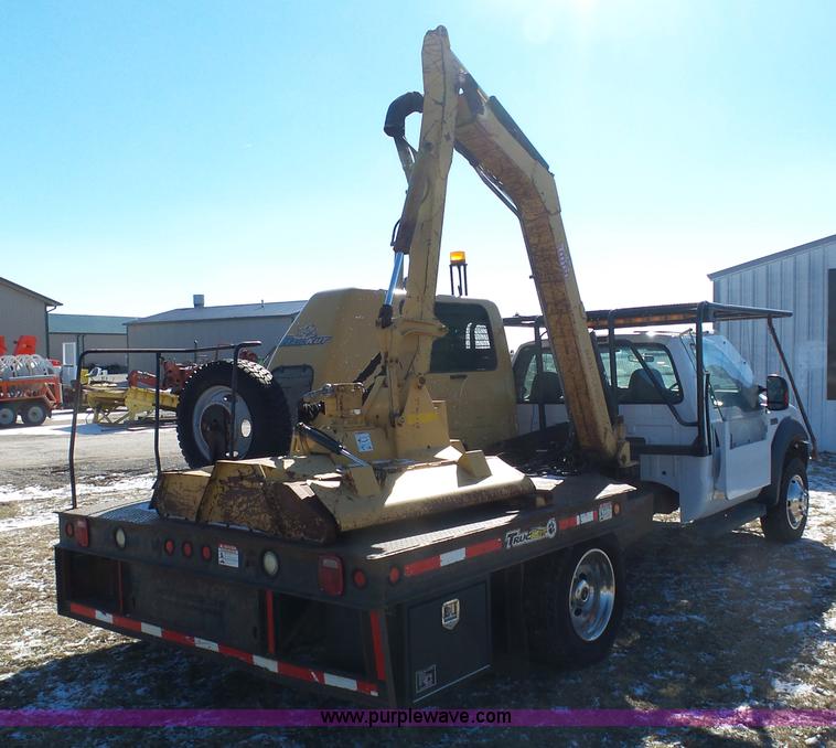 image for item AX9224 2006 Ford F550 flatbed truck with Tiger Rail Kat boom mower
