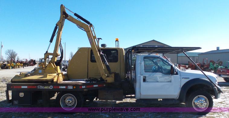 image for item AX9224 2006 Ford F550 flatbed truck with Tiger Rail Kat boom mower