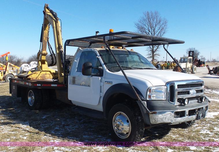 image for item AX9224 2006 Ford F550 flatbed truck with Tiger Rail Kat boom mower