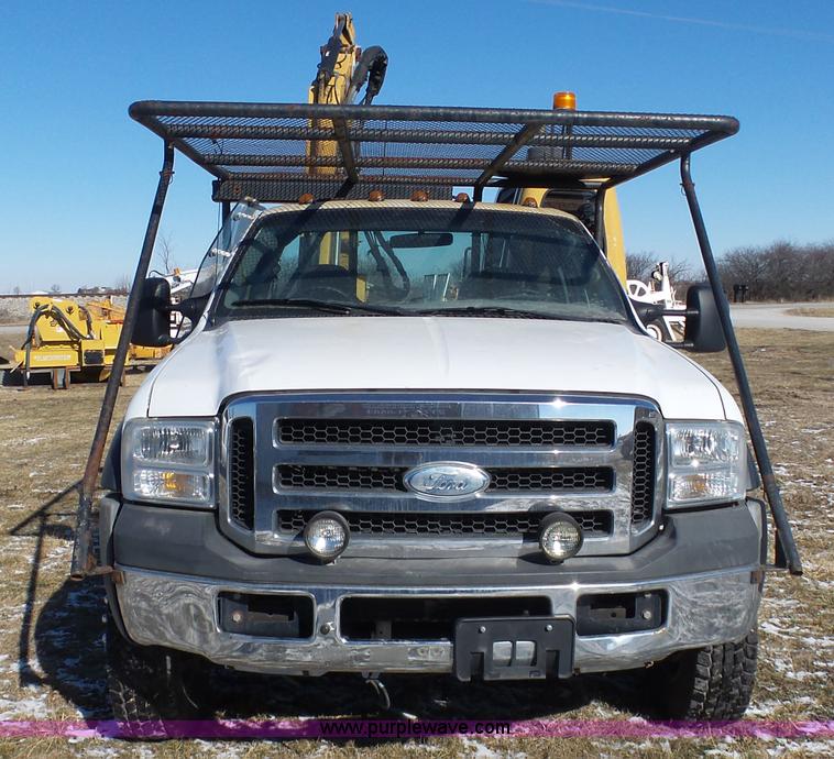 image for item AX9224 2006 Ford F550 flatbed truck with Tiger Rail Kat boom mower