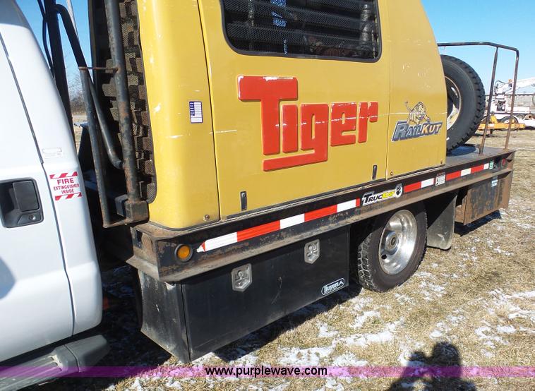 image for item AX9224 2006 Ford F550 flatbed truck with Tiger Rail Kat boom mower