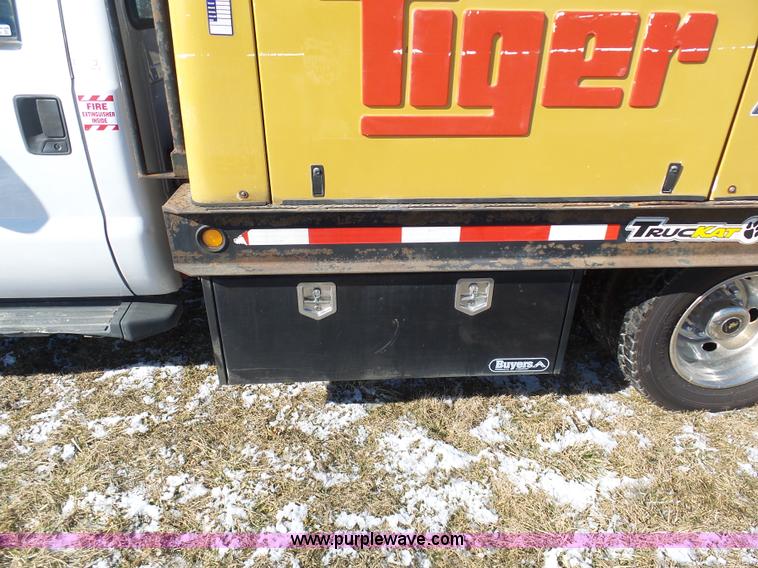 image for item AX9224 2006 Ford F550 flatbed truck with Tiger Rail Kat boom mower