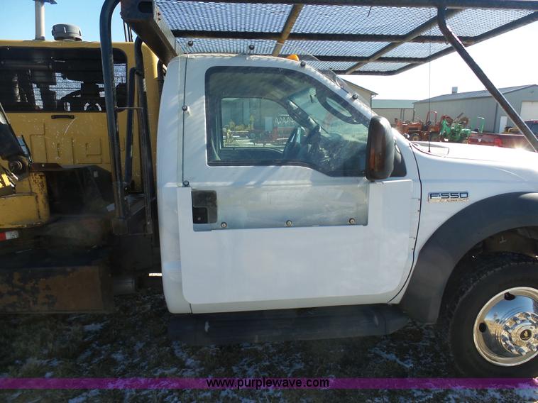 image for item AX9224 2006 Ford F550 flatbed truck with Tiger Rail Kat boom mower