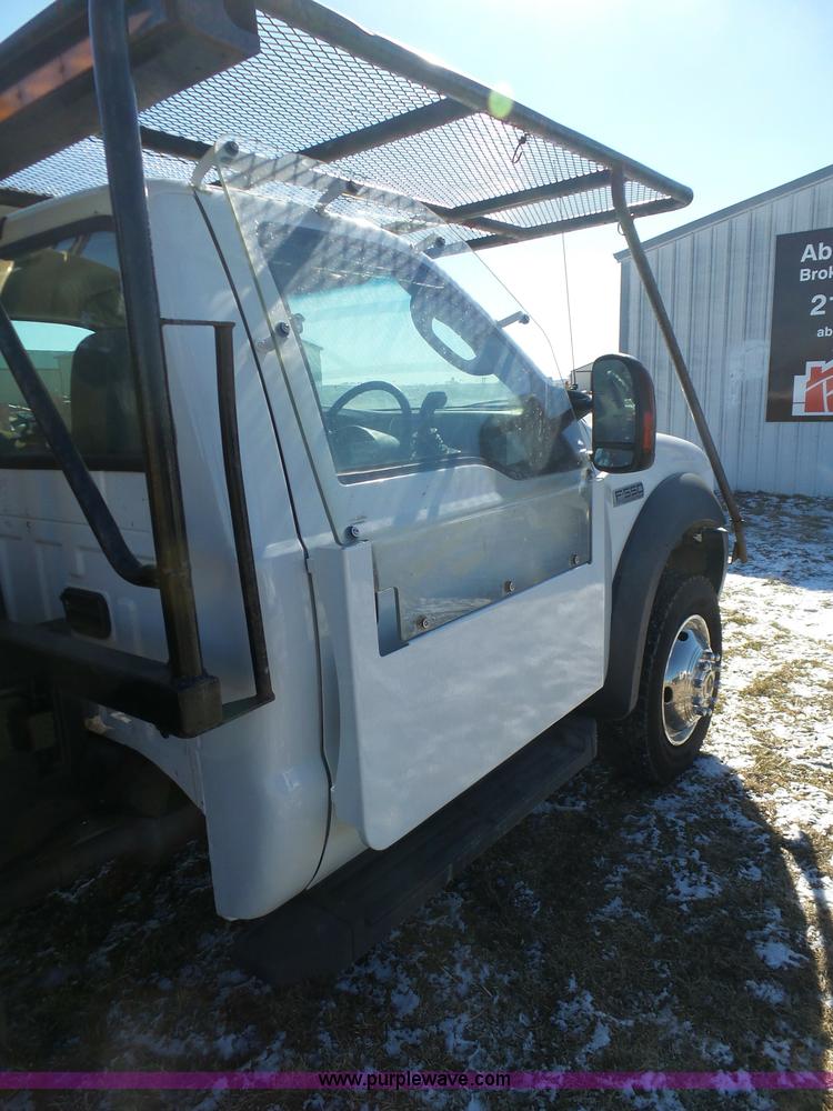 image for item AX9224 2006 Ford F550 flatbed truck with Tiger Rail Kat boom mower