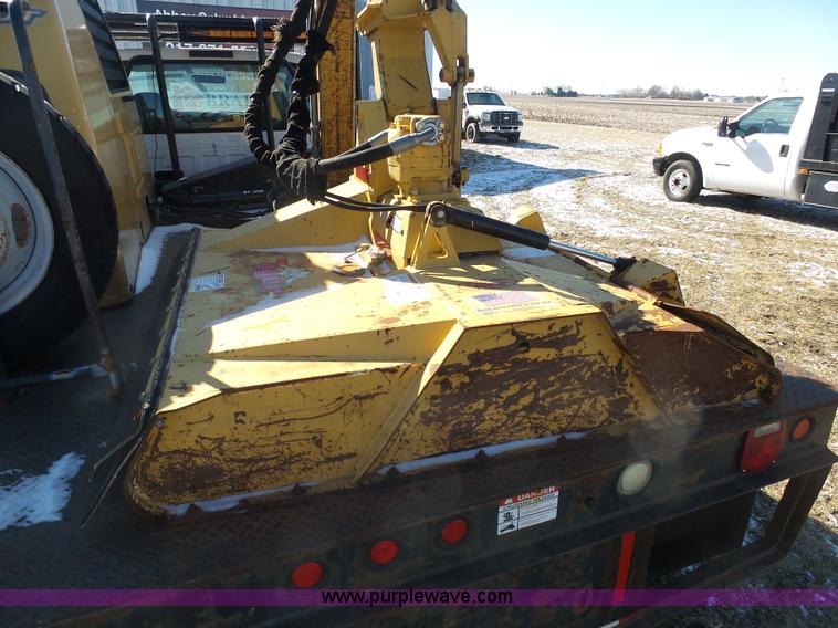 image for item AX9224 2006 Ford F550 flatbed truck with Tiger Rail Kat boom mower