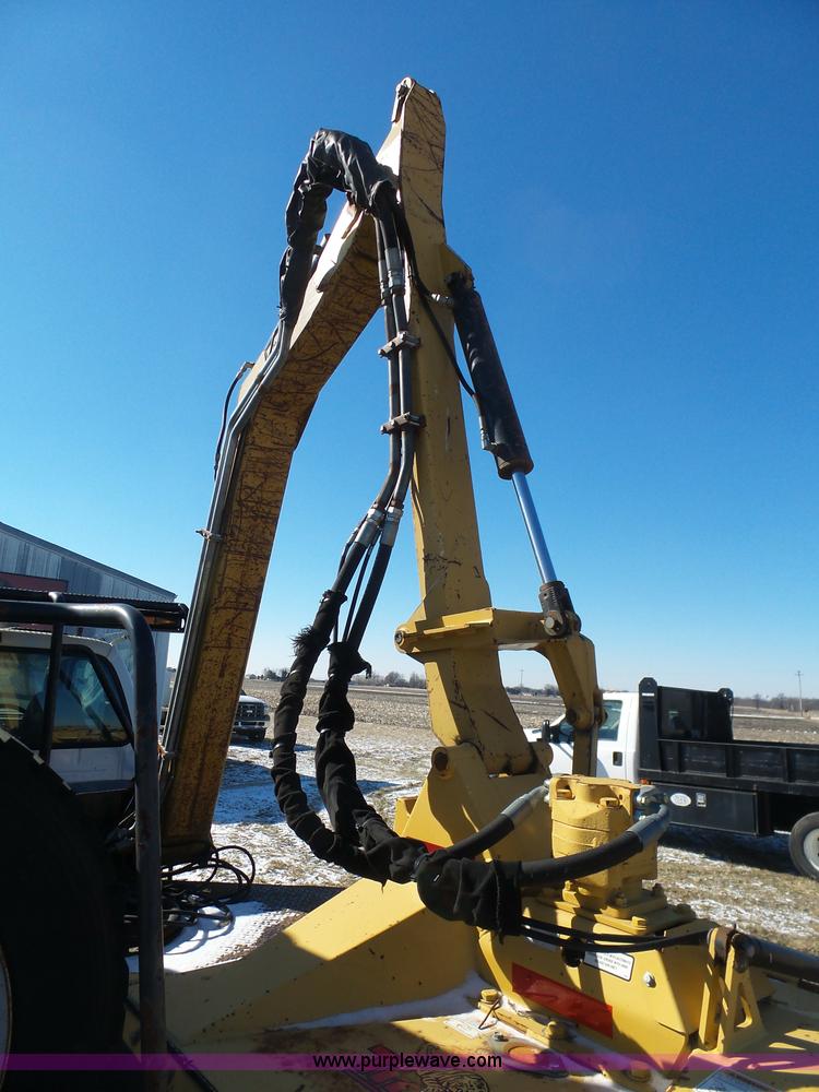 image for item AX9224 2006 Ford F550 flatbed truck with Tiger Rail Kat boom mower