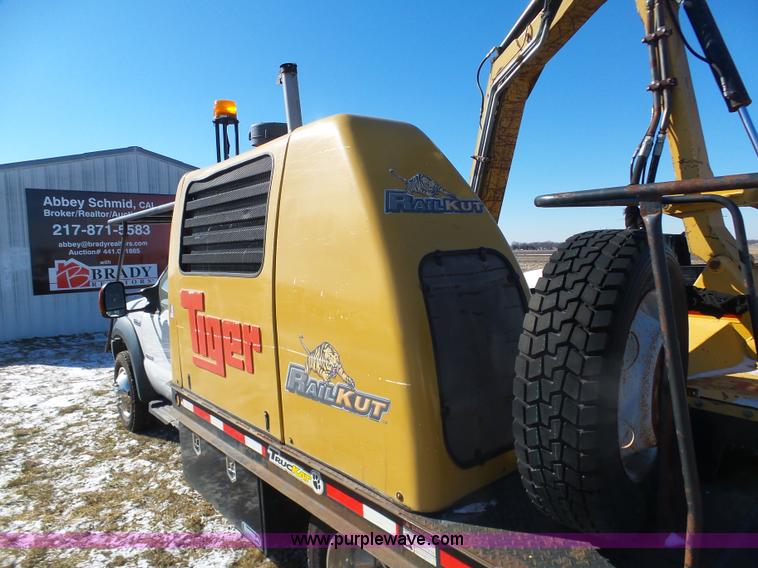 image for item AX9224 2006 Ford F550 flatbed truck with Tiger Rail Kat boom mower