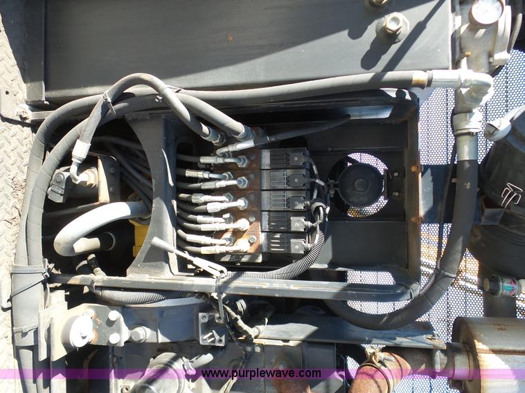 image for item AX9224 2006 Ford F550 flatbed truck with Tiger Rail Kat boom mower