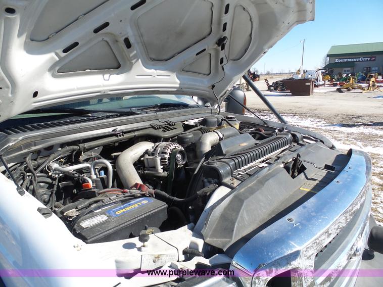 image for item AX9224 2006 Ford F550 flatbed truck with Tiger Rail Kat boom mower