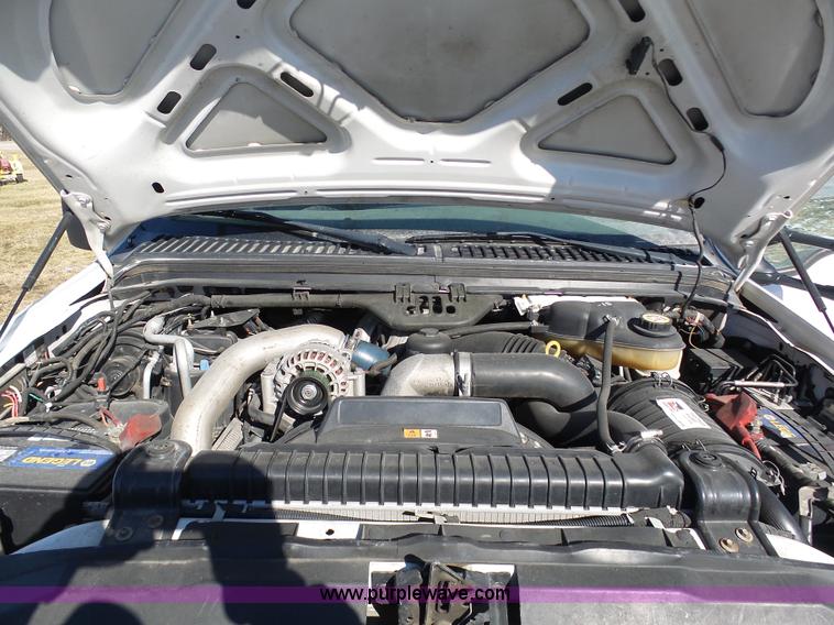 image for item AX9224 2006 Ford F550 flatbed truck with Tiger Rail Kat boom mower