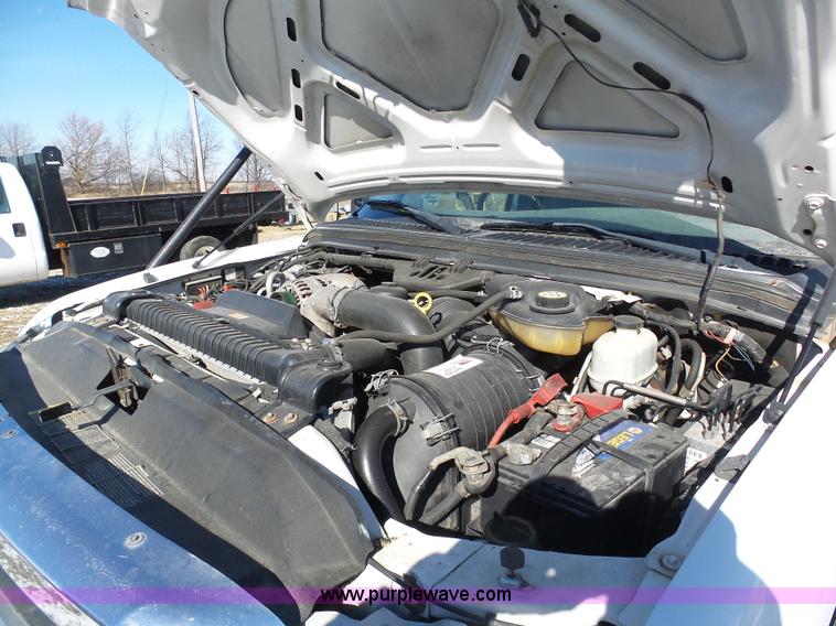 image for item AX9224 2006 Ford F550 flatbed truck with Tiger Rail Kat boom mower