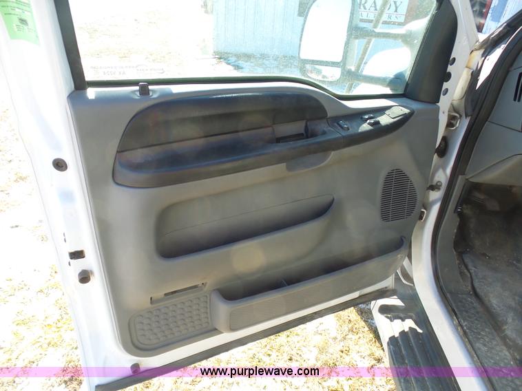 image for item AX9224 2006 Ford F550 flatbed truck with Tiger Rail Kat boom mower