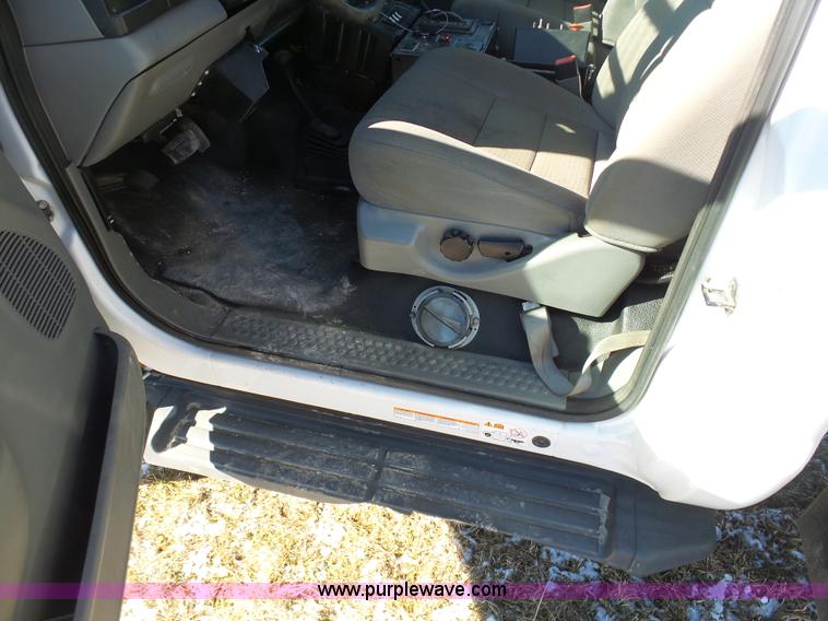 image for item AX9224 2006 Ford F550 flatbed truck with Tiger Rail Kat boom mower