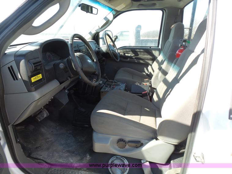 image for item AX9224 2006 Ford F550 flatbed truck with Tiger Rail Kat boom mower