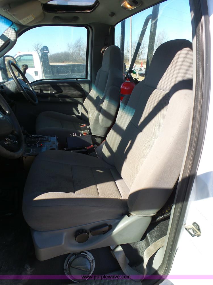 image for item AX9224 2006 Ford F550 flatbed truck with Tiger Rail Kat boom mower