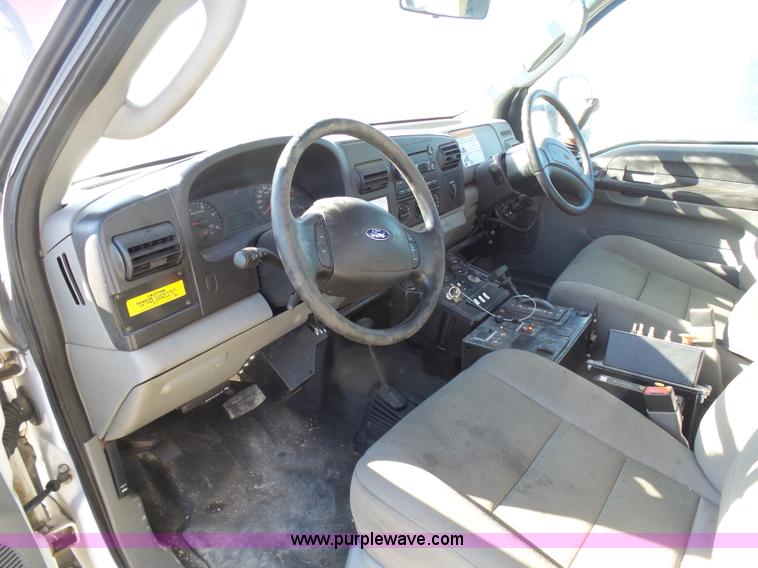 image for item AX9224 2006 Ford F550 flatbed truck with Tiger Rail Kat boom mower