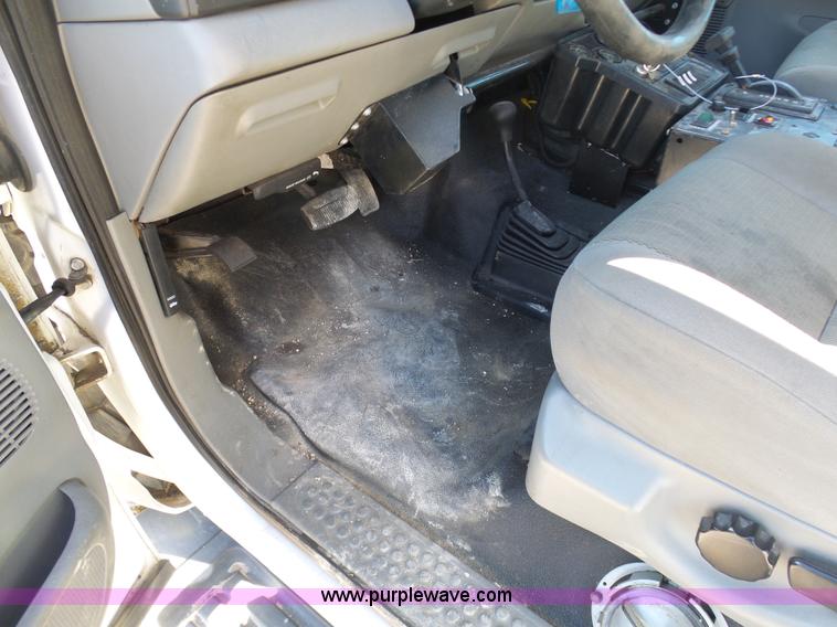 image for item AX9224 2006 Ford F550 flatbed truck with Tiger Rail Kat boom mower