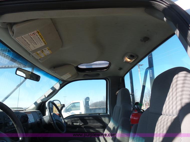 image for item AX9224 2006 Ford F550 flatbed truck with Tiger Rail Kat boom mower