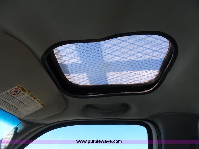 image for item AX9224 2006 Ford F550 flatbed truck with Tiger Rail Kat boom mower