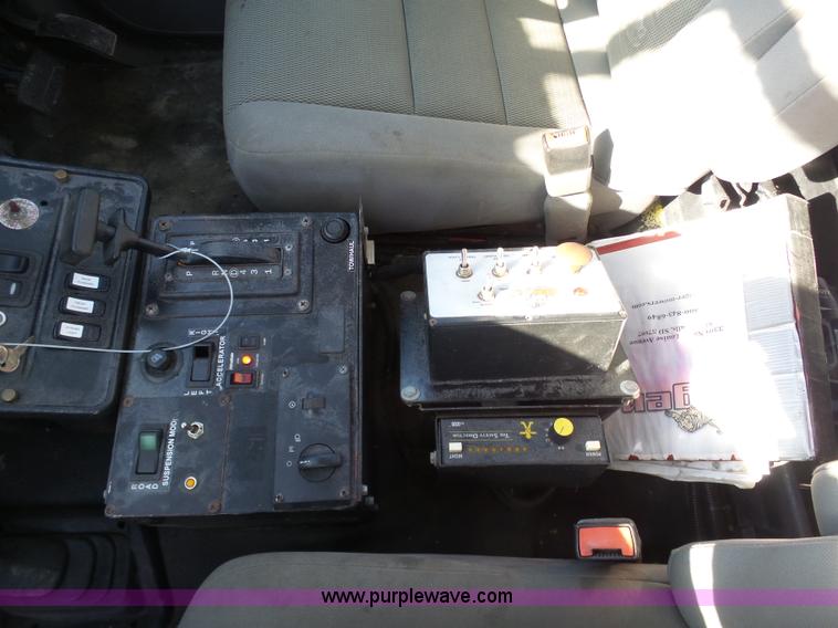 image for item AX9224 2006 Ford F550 flatbed truck with Tiger Rail Kat boom mower