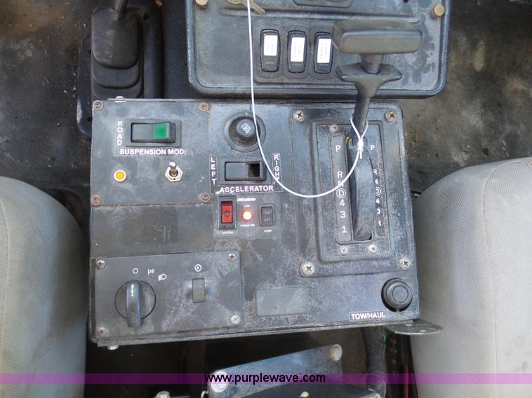 image for item AX9224 2006 Ford F550 flatbed truck with Tiger Rail Kat boom mower