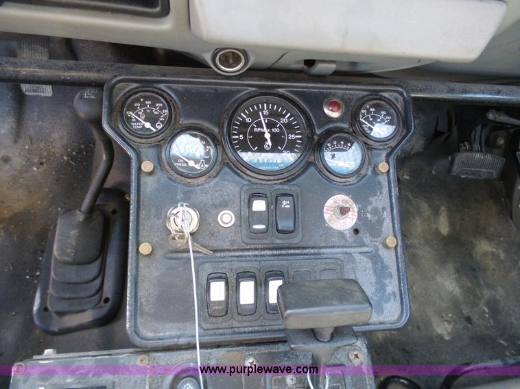 image for item AX9224 2006 Ford F550 flatbed truck with Tiger Rail Kat boom mower