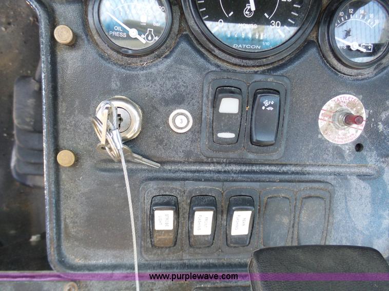 image for item AX9224 2006 Ford F550 flatbed truck with Tiger Rail Kat boom mower