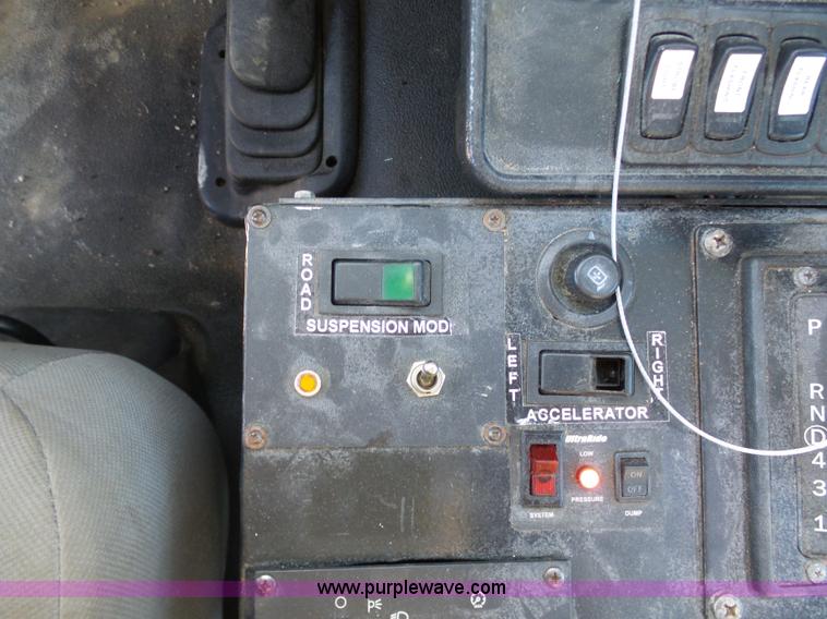 image for item AX9224 2006 Ford F550 flatbed truck with Tiger Rail Kat boom mower