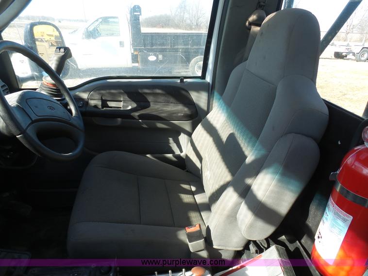 image for item AX9224 2006 Ford F550 flatbed truck with Tiger Rail Kat boom mower