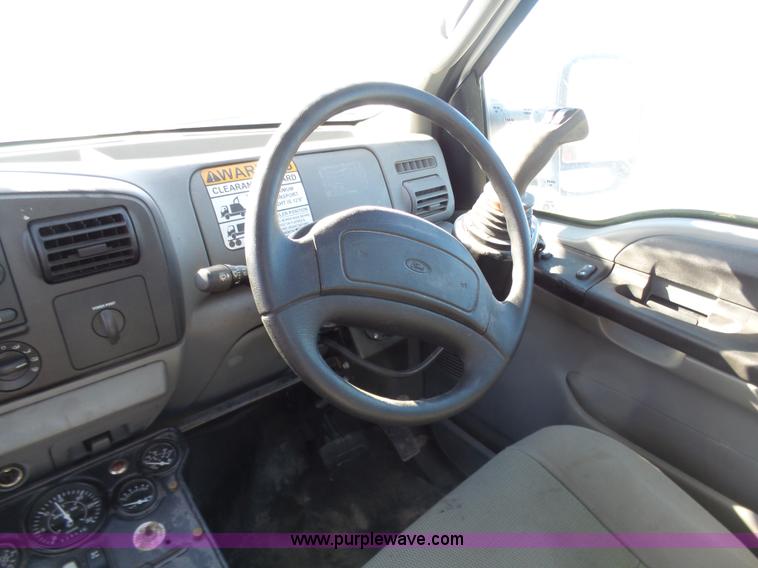 image for item AX9224 2006 Ford F550 flatbed truck with Tiger Rail Kat boom mower