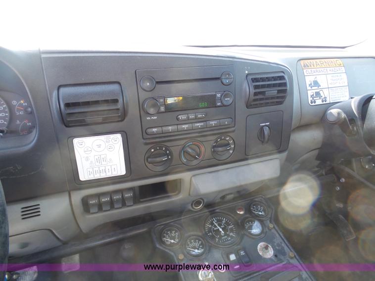 image for item AX9224 2006 Ford F550 flatbed truck with Tiger Rail Kat boom mower