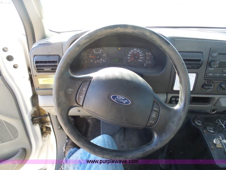 image for item AX9224 2006 Ford F550 flatbed truck with Tiger Rail Kat boom mower