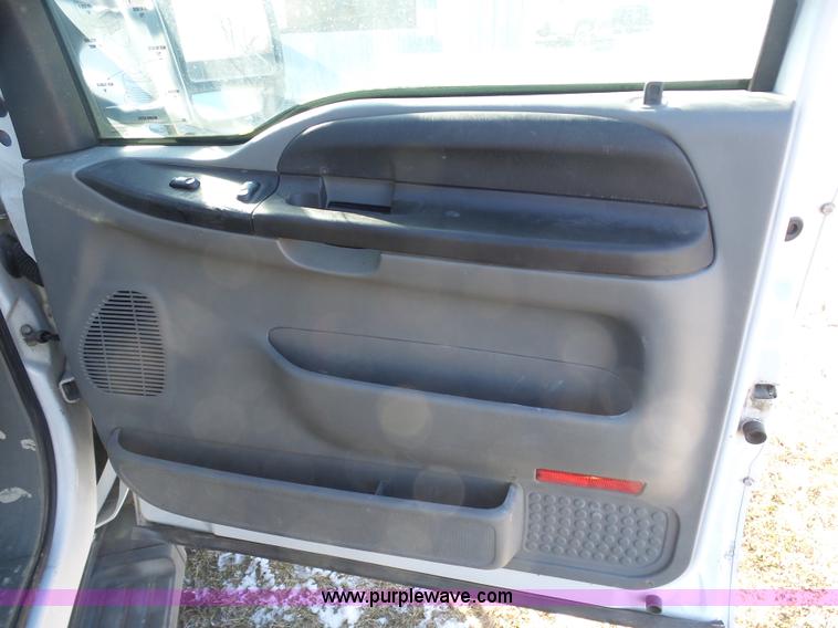 image for item AX9224 2006 Ford F550 flatbed truck with Tiger Rail Kat boom mower