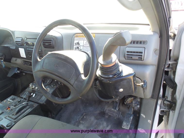 image for item AX9224 2006 Ford F550 flatbed truck with Tiger Rail Kat boom mower