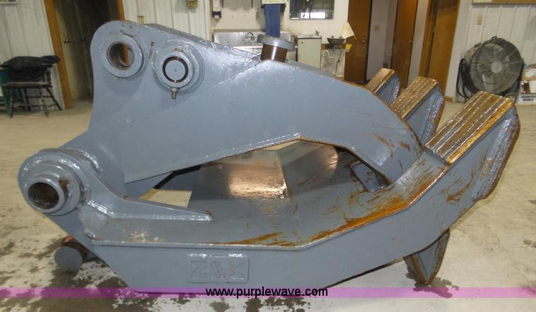image for item J8819 NPK GR2530 excavator grapple attachment