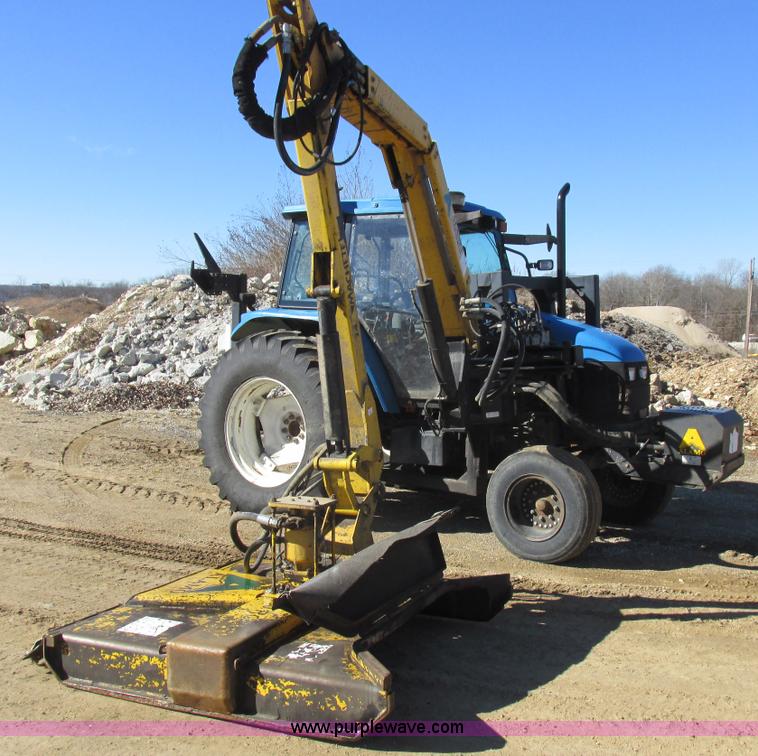 image for item L7087 1999 Ford New Holland TS110 tractor with side boom mower