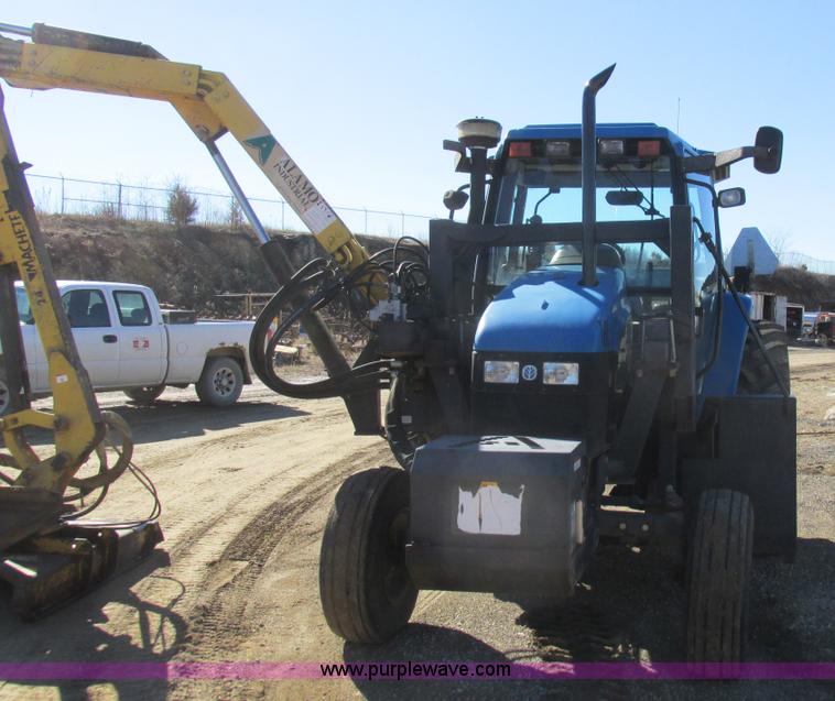 image for item L7087 1999 Ford New Holland TS110 tractor with side boom mower