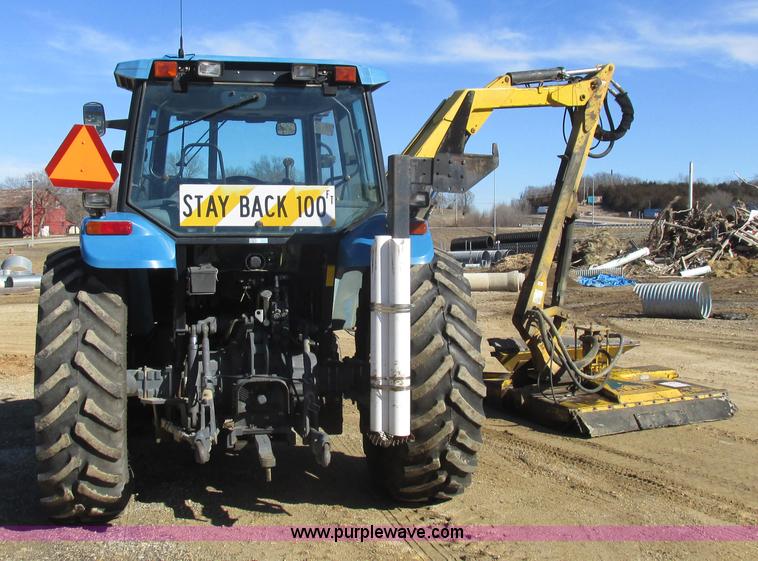image for item L7087 1999 Ford New Holland TS110 tractor with side boom mower