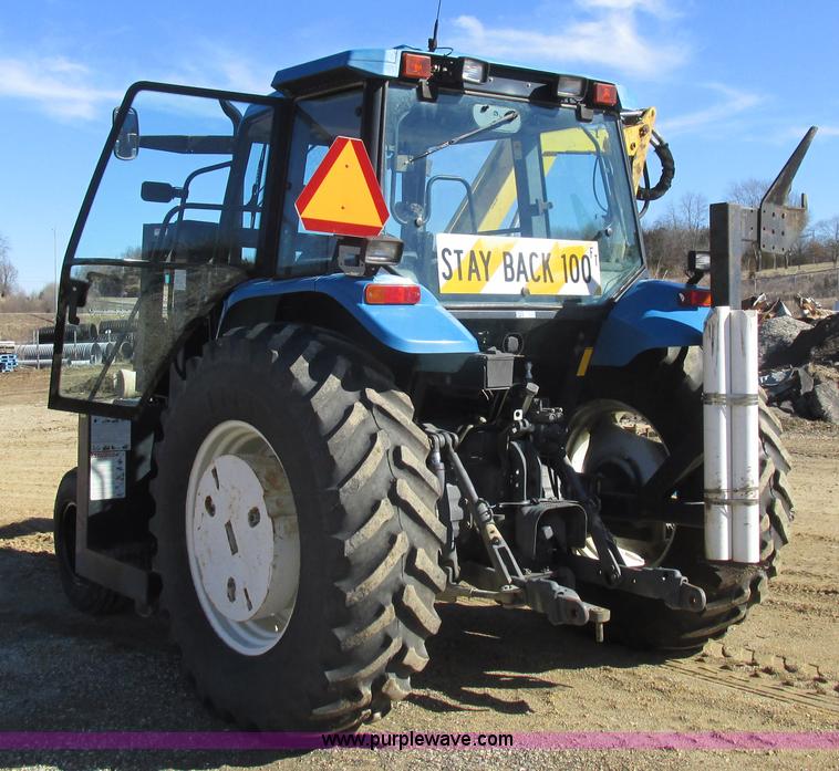 image for item L7087 1999 Ford New Holland TS110 tractor with side boom mower