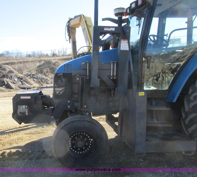 image for item L7087 1999 Ford New Holland TS110 tractor with side boom mower