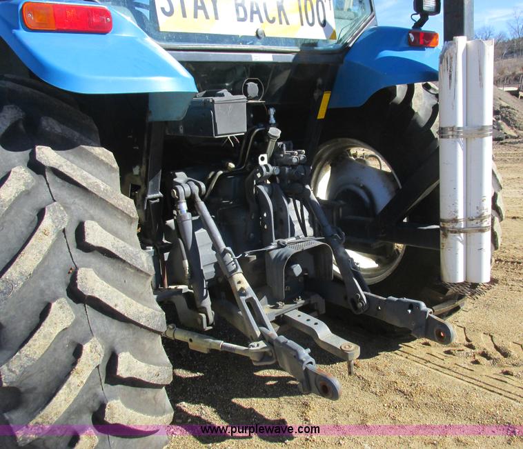 image for item L7087 1999 Ford New Holland TS110 tractor with side boom mower