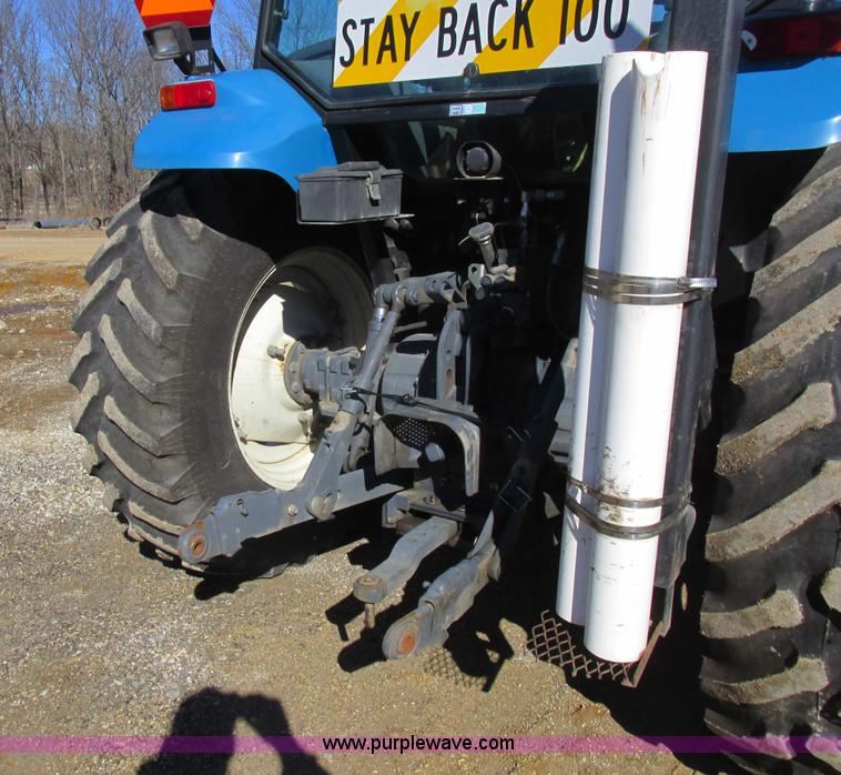 image for item L7087 1999 Ford New Holland TS110 tractor with side boom mower