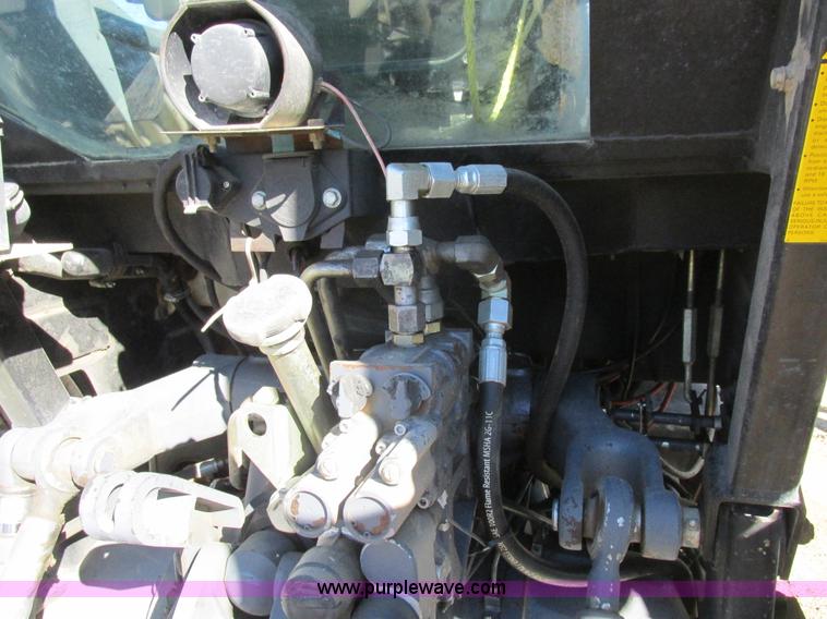 image for item L7087 1999 Ford New Holland TS110 tractor with side boom mower