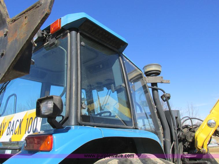 image for item L7087 1999 Ford New Holland TS110 tractor with side boom mower