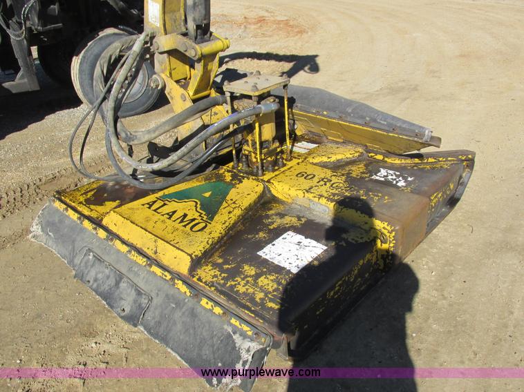 image for item L7087 1999 Ford New Holland TS110 tractor with side boom mower