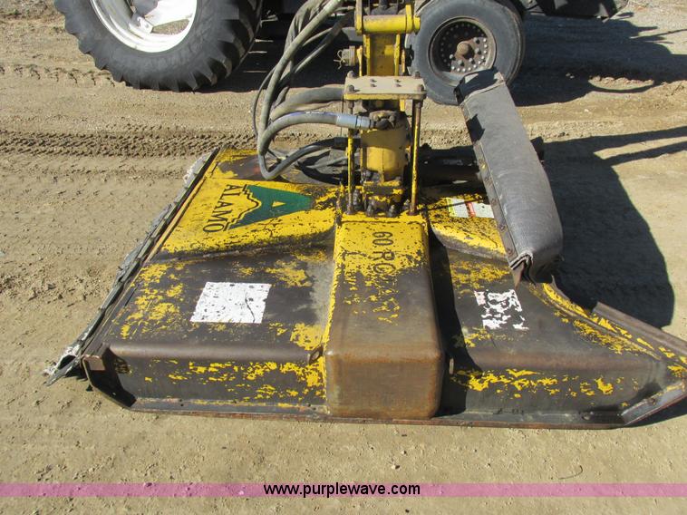 image for item L7087 1999 Ford New Holland TS110 tractor with side boom mower